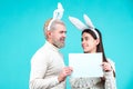 Happy Easter. Bunny couple dressed in costume Easter rabbit bunny on blue background isolated. Royalty Free Stock Photo