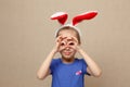 Cute little child girl wearing bunny ears on Easter day.