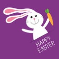 Happy Easter. Bunny rabbit hare holding carrot Paper pocket. Baby greeting card. Violet background. Flat design. Royalty Free Stock Photo