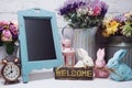 Happy Easter with bunny rabbit and space copy wooden easel background