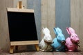 Happy Easter with bunny rabbit and space copy wooden easel background