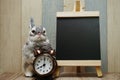 Happy Easter with bunny rabbit and space copy wooden easel background