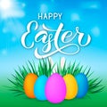 Happy Easter calligraphy lettering. Easter eggs on grass and bunny s ears. Spring holidays vector illustration. Easy to edit Royalty Free Stock Photo