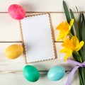 Happy Easter Card with Eggs in a Row on Bottom with Daffodil Flowers on the side of White Shiplap Board Background with room or sp