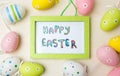Happy Easter card in a frame with colorful eggs Royalty Free Stock Photo