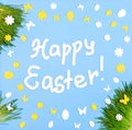 Happy Easter card with frame of green grass, decorative white and yellow eggs and flowers on blue. Royalty Free Stock Photo