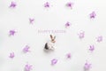 Happy easter card. Stylish minimalistic composition on a white background. Figurine of a rabbit and delicate spring