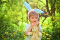 Happy easter. Childhood. Egg hunt on spring holiday. love easter. Family holiday. Little boy child in green forest Royalty Free Stock Photo