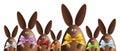 Happy easter, chocolate bunnies with ribbons bows in various colors isolated on white Royalty Free Stock Photo