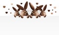 Happy easter, chocolate funny bunnies with heart shape showing t Royalty Free Stock Photo