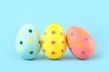 Happy Easter. Close-up of three colored easter painted eggs Royalty Free Stock Photo