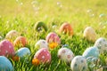 Happy easter!  Closeup Colorful Easter eggs in nest on green grass field during sunset background Royalty Free Stock Photo