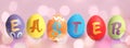 Happy Easter. Colorful dyed eggs on pink background