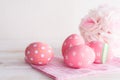 Happy easter! Colorful of Easter eggs with pink and white cheesecloth on wooden background Royalty Free Stock Photo