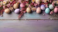 Happy Easter composition. Easter eggs in basket on colored table with yellow Tulips. Natural dyed colorful eggs background top