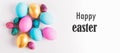 Happy easter concept. Big small eggs of various fashionable colors lie in pile on a white background text Happy Easter.