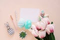 Happy Easter concept with blank card and colorful easter eggs and pink tulip