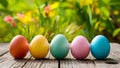 Happy Easter concept colorful eggs on wooden table outdoors Royalty Free Stock Photo