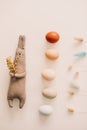 Happy Easter concept. Funny handmade bunny rabbit toy and chicken eggs