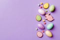 Happy Easter concept. Preparation for holiday. Easter eggs on colored background. flat lay top view copy space banner Royalty Free Stock Photo