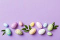 Happy Easter concept. Preparation for holiday. Easter eggs on colored background. flat lay top view copy space banner Royalty Free Stock Photo