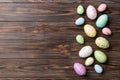 Happy Easter concept. Preparation for holiday. Easter eggs on colored background. flat lay top view copy space banner Royalty Free Stock Photo