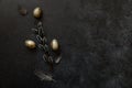 Happy Easter concept. Preparation for holiday. Golden decorated easter eggs willow feather on trendy grunge scratched Royalty Free Stock Photo