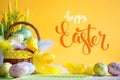 Happy Easter. Congratulatory easter background. Easter eggs and flowers. Selective focus. .Horizontal