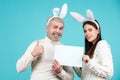 Happy Easter couple. Funny picture of funny couple with rabbit ears. Isolated, text, background and copy space. Royalty Free Stock Photo