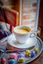 Happy Easter. Cup of coffee espresso and colorful chocolate eggs Royalty Free Stock Photo