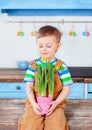Happy easter. Cute boy getting ready for the holiday. Easter decoration Royalty Free Stock Photo