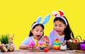 Happy Easter day. Happy Easter day. Kid with colorful eggs toy on yellow background. Royalty Free Stock Photo