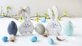 Happy easter. Decorative wooden eggs and funny bunnys on grey background. Festive decoration. Holiday concept