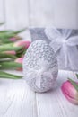 Happy Easter. Easter egg and pink tulips on a white background Royalty Free Stock Photo