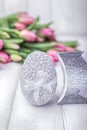 Happy Easter. Easter egg and pink tulips on a white background Royalty Free Stock Photo