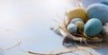 Happy Easter; Easter eggs on blue table background. Holidays vie