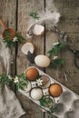 Happy Easter! Easter rustic still life. Natural easter eggs, blooming spring flowers, burlap and spoon  flat lay on rural wooden Royalty Free Stock Photo