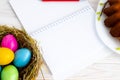 happy Easter easter eggs, cupcake. place for text in the form of a notepad and pen Royalty Free Stock Photo