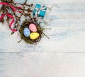 Gift boxes with ribbons. Happy Easter. Willow twigs. Holy Easter. Blue turquoise background. Easter eggs in the nest Royalty Free Stock Photo