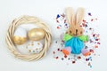 Happy Easter. eggs and rabbit on white background.. Balls, wreath woven from the vines. Copy space for text. Top view Royalty Free Stock Photo