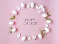 Happy Easter Eggs spring holiday with spring flowers petal and yellow copy space on pink background concept copy space