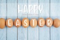 Happy easter on eggs with Sunday, March 31, 2024 on wooden floor