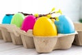 Happy Easter Eggs in a tray on a white background. Royalty Free Stock Photo