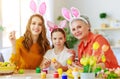 Happy Easter! family grandmother, mother and child paint eggs and prepare for holiday Royalty Free Stock Photo