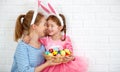 Happy easter! family mother and child daughter with ears hare ge Royalty Free Stock Photo