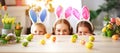 Happy easter! family mother and children with ears hare getting ready for holiday Royalty Free Stock Photo