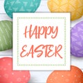 Happy Easter. Festive easter eggs in square on shabby wooden background.