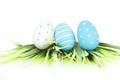 Happy Easter - few eggs with grass on the white background