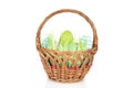 Happy Easter - few eggs on the wooden basket with a grass on the white background