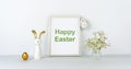 Happy Easter. Frame and flowers on background of white table and wall. Eggs and fun rabbit with golden ears. Decor Royalty Free Stock Photo